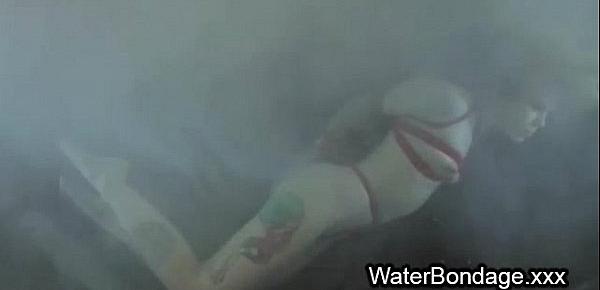  Blonde in ropes dived in water basin